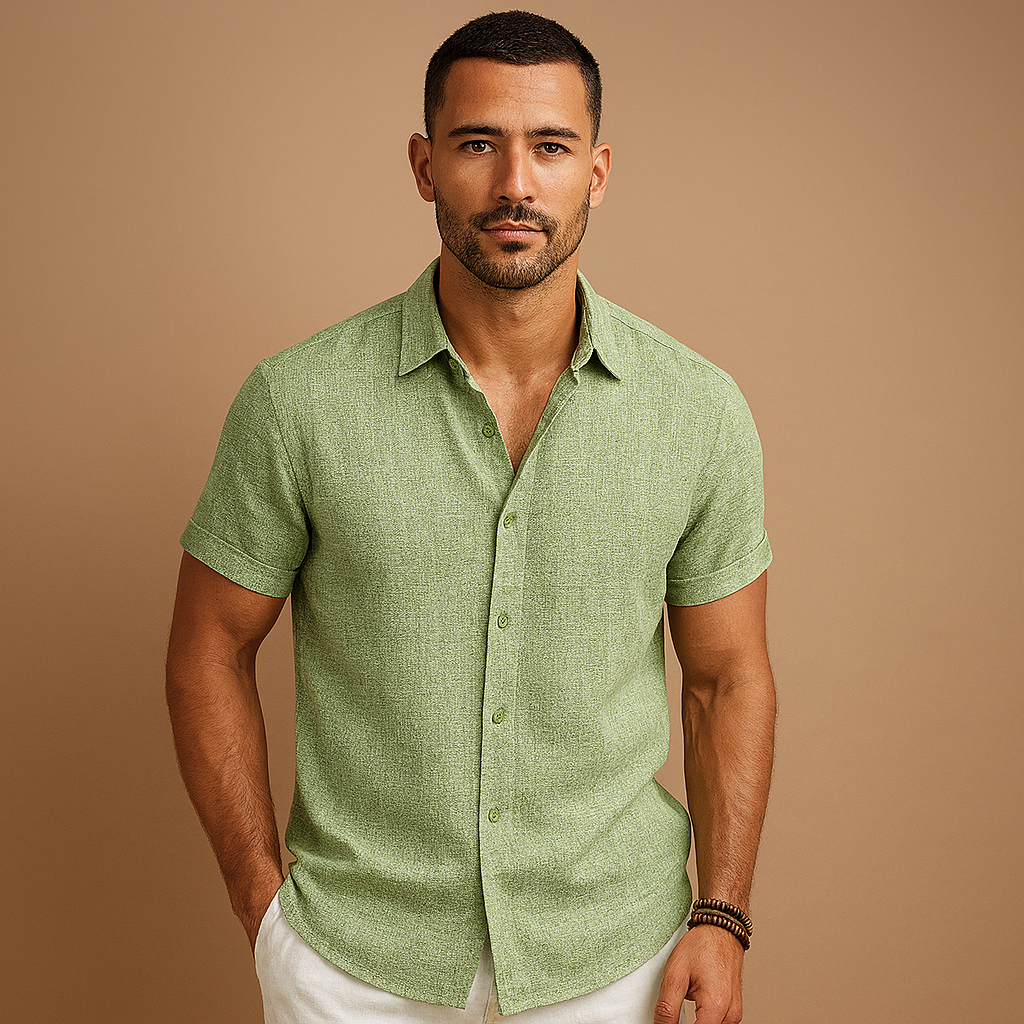 Man wearing a green short-sleeve shirt against a brown background