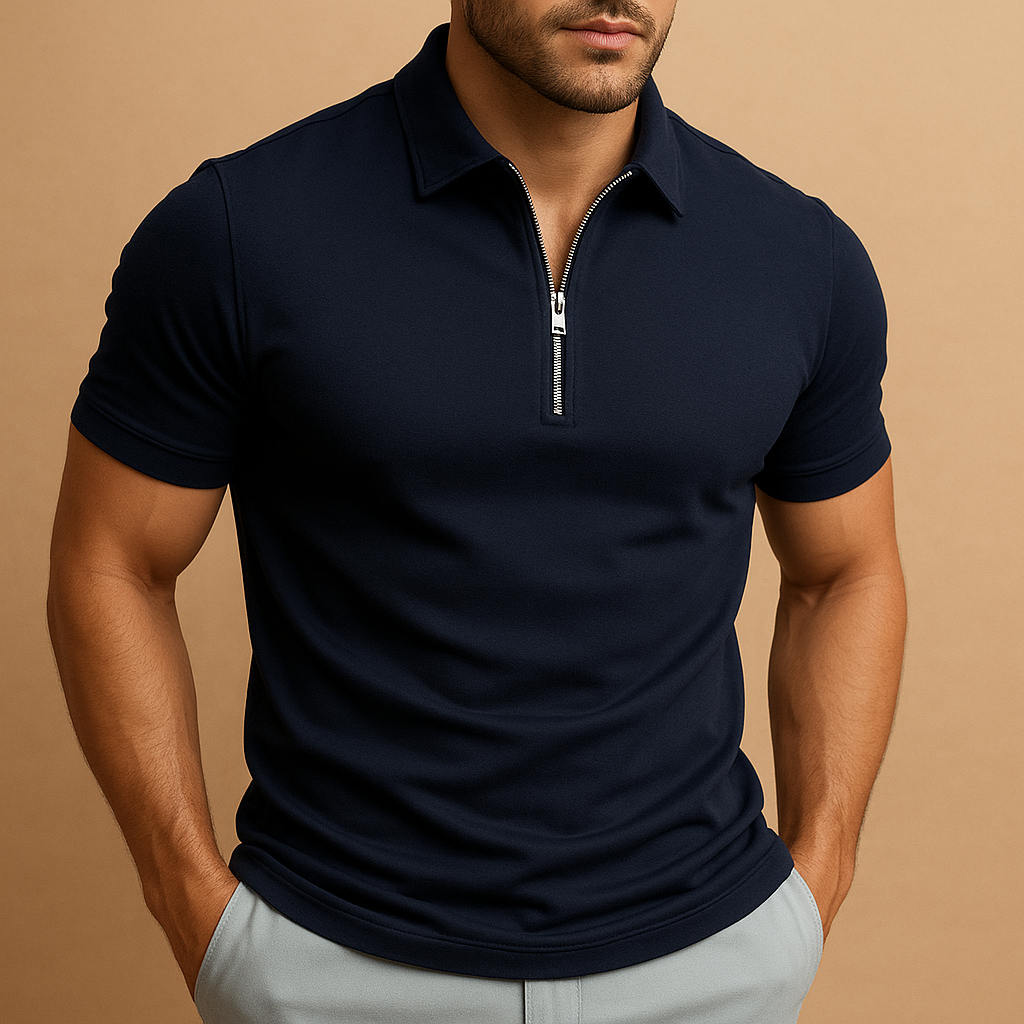 Man wearing a navy blue polo shirt with a zipper on a beige background