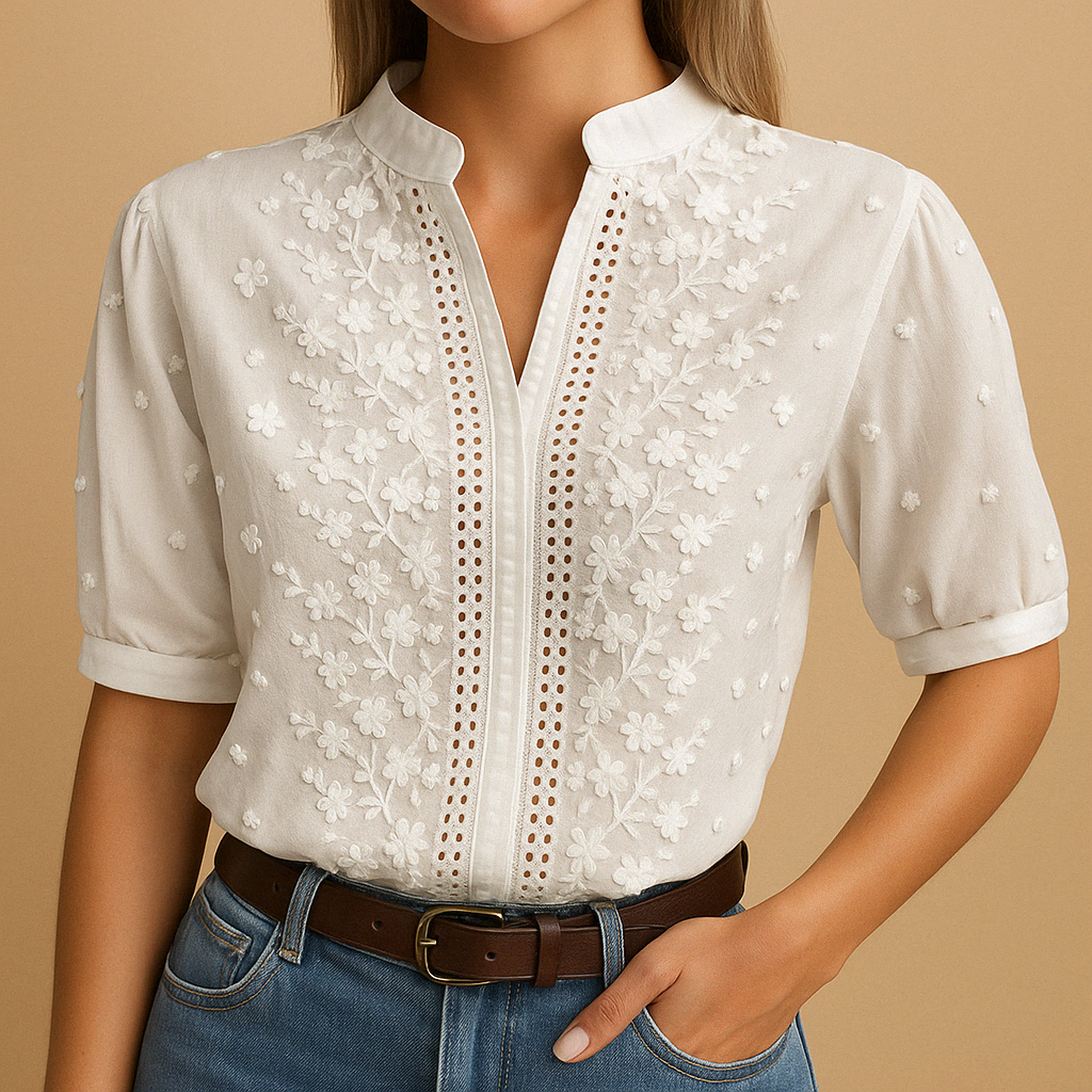 White lace blouse with a brown belt on a beige background
